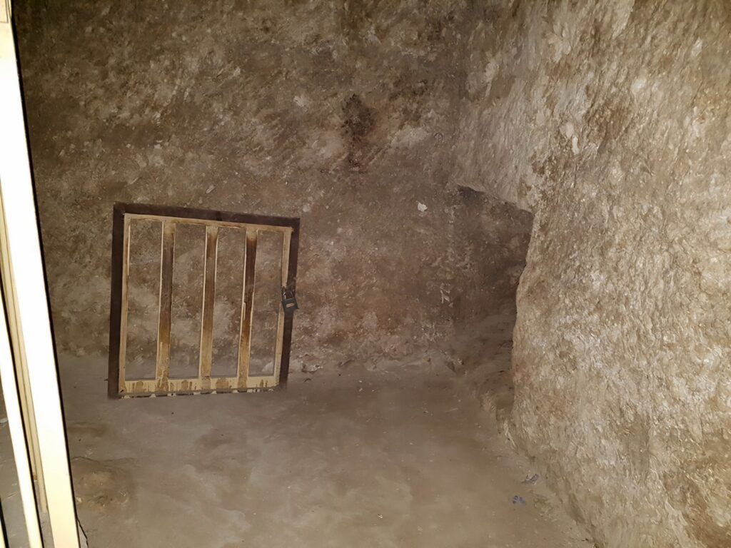 Archaeologists exploring a newly discovered passageway inside the Great Pyramid of Giza, uncovering hidden chambers.