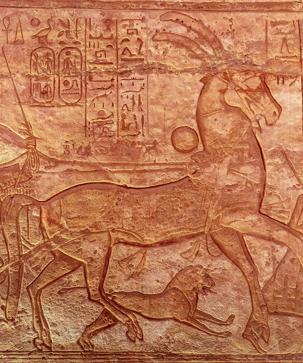 Illuminated ritual corridor leading toward the Abu Simbel sanctuary