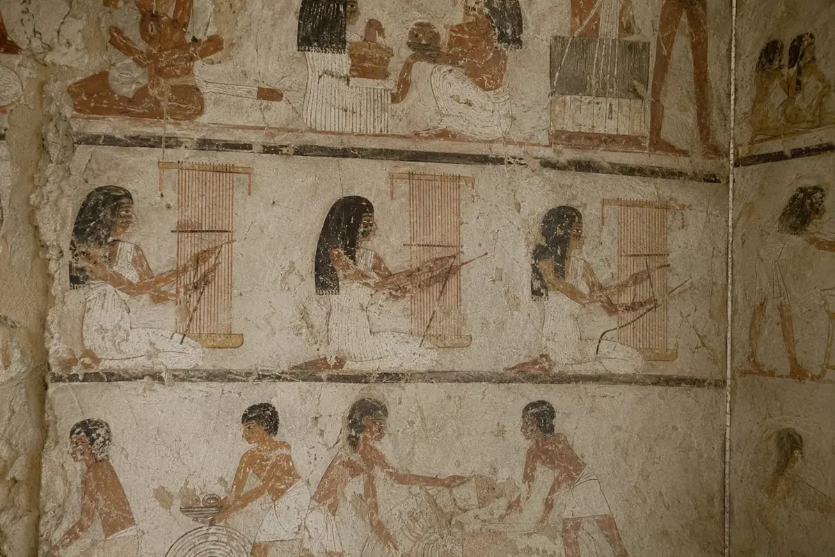 Ancient weaving and craft scenes on painted plaster